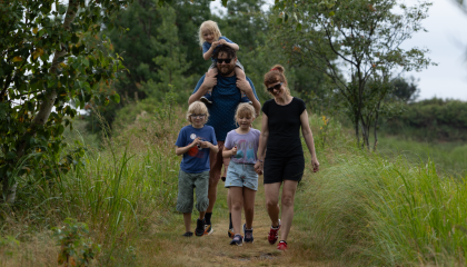 Family walking on trail